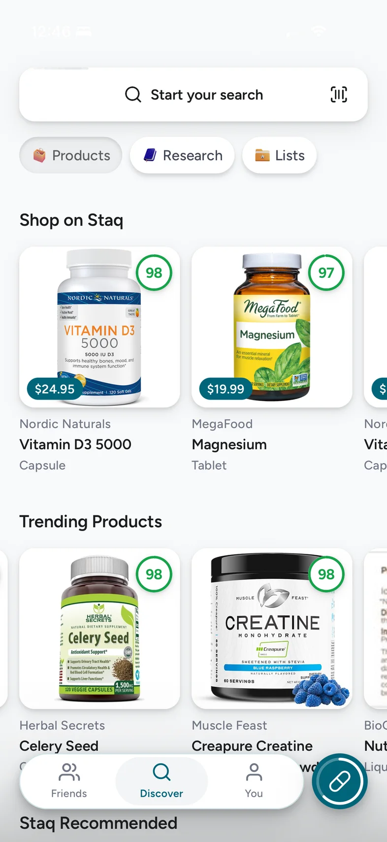 The Discover tab in the Staq app: Shop on Staq and Trending Products, each product photo carrying its score.